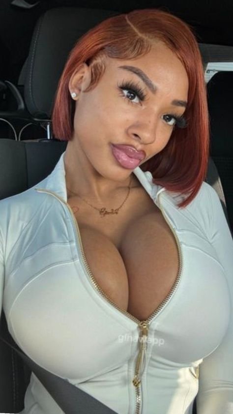 Flirty curvy UK phone chat model Aria Novelle with auburn bob and confident presence