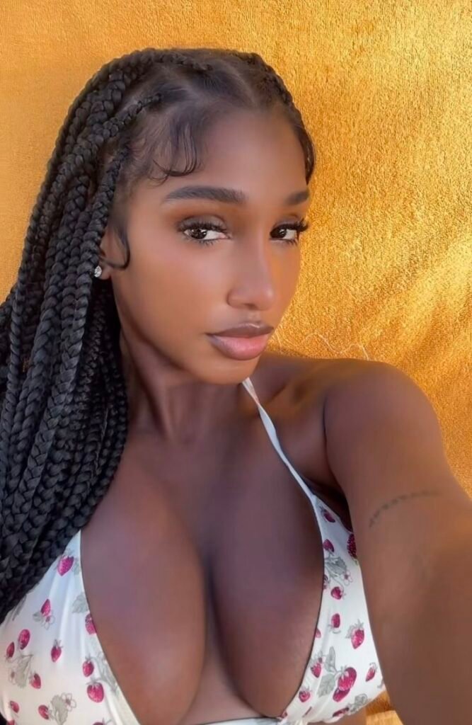 Confident woman with braids representing phone sex chat UK and adult chat with horny girls