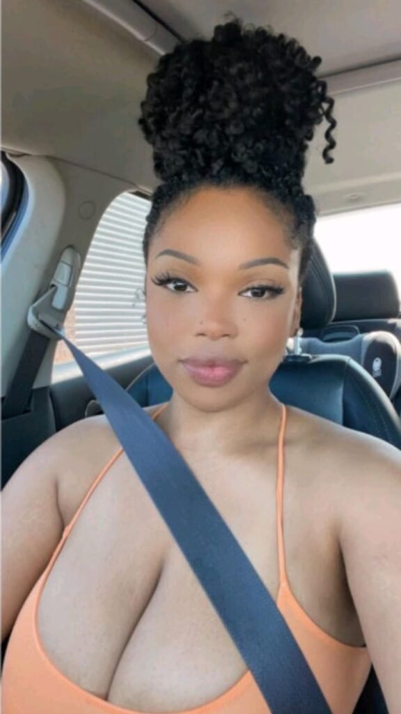 Natural curvy UK phone chat model Tahlia Renne with high bun and calm confident presence