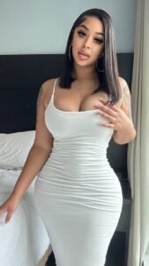Elegant UK phone chat model with confident feminine pose
