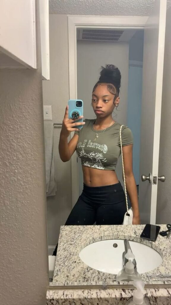 Confident woman taking a mirror selfie representing phone sex chat UK and adult chat