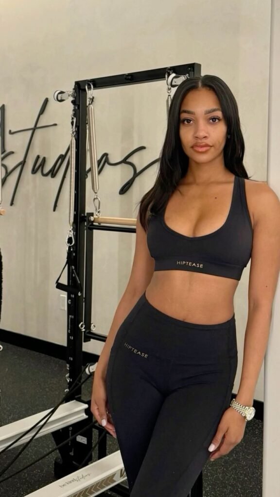 Athletic confident woman in gym wear representing UK phone sex chat and adult chat