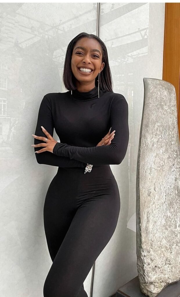 Confident elegant woman in black outfit representing phone sex chat UK and adult chat