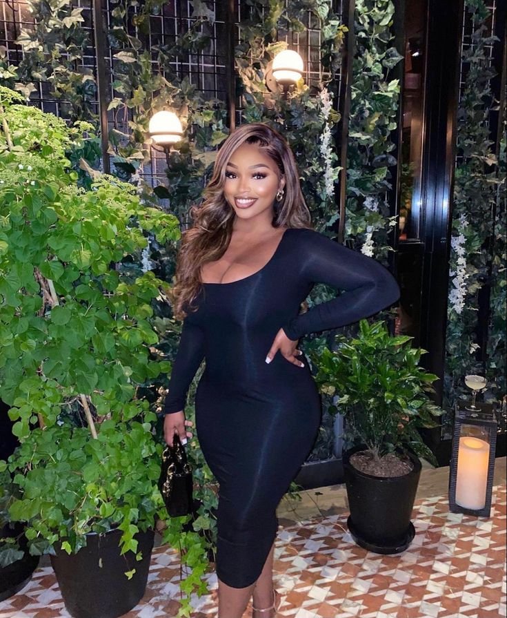 Elegant woman in black dress representing adult chat UK and phone sex chat