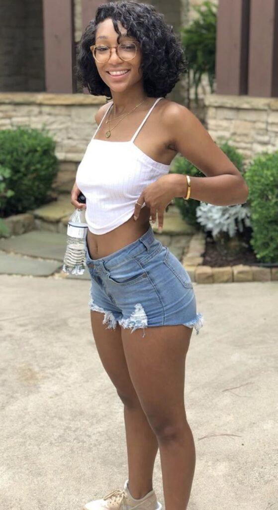 Smiling confident woman outdoors representing adult chat UK and phone sex chat