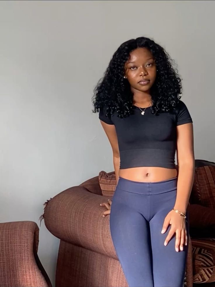 Confident woman in casual fitted wear representing UK phone sex chat and adult chat