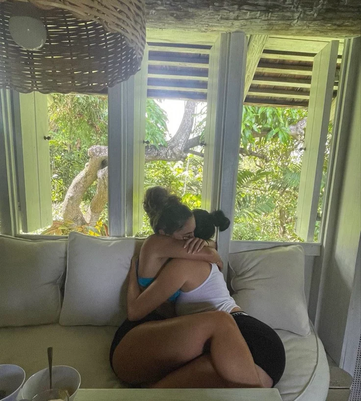 Girls on girls chat UK profile featuring two women embracing Lesbian phone chat UK female couple in a cozy indoor setting Women seeking women chat profile with relaxed atmosphere Girls on girls phone chat UK profile image Lesbian chat lines UK friendly female duo