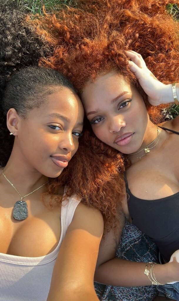Girls on girls chat UK profile featuring two women relaxing together Lesbian phone chat UK female duo with natural hairstyles Women seeking women chat profile outdoors Girls on girls phone chat UK profile image Lesbian chat lines UK confident female pair Adult chat UK girls on girls category profile