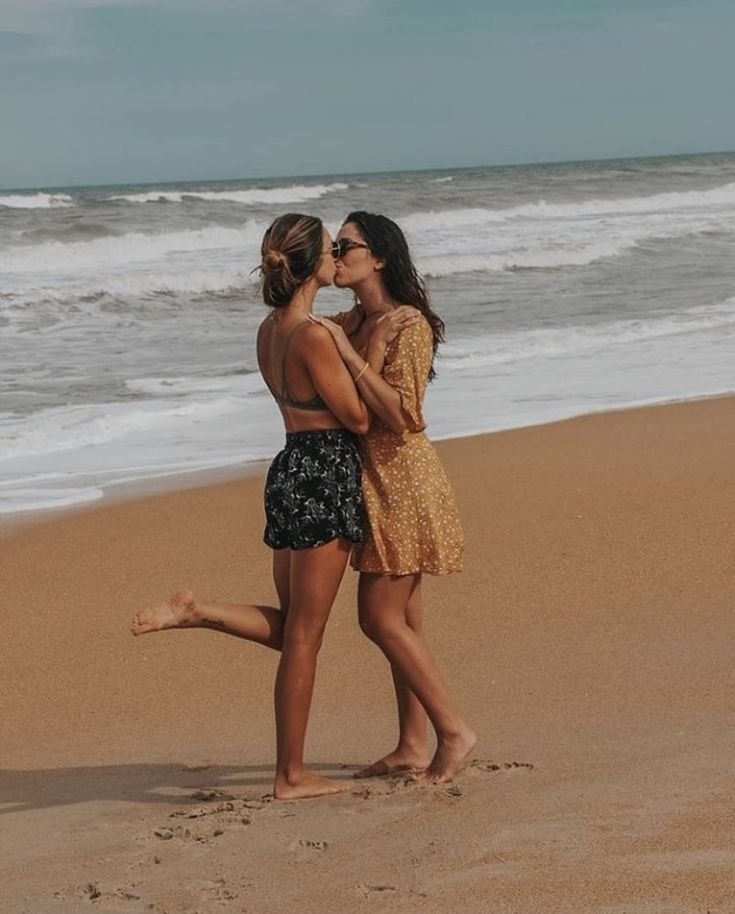 Girls on girls chat UK profile featuring two women on the beach Lesbian phone chat UK female couple by the ocean Women seeking women chat profile in a seaside setting Girls on girls phone chat UK beach profile image Lesbian chat lines UK confident female duo Adult chat UK girls on girls category profile