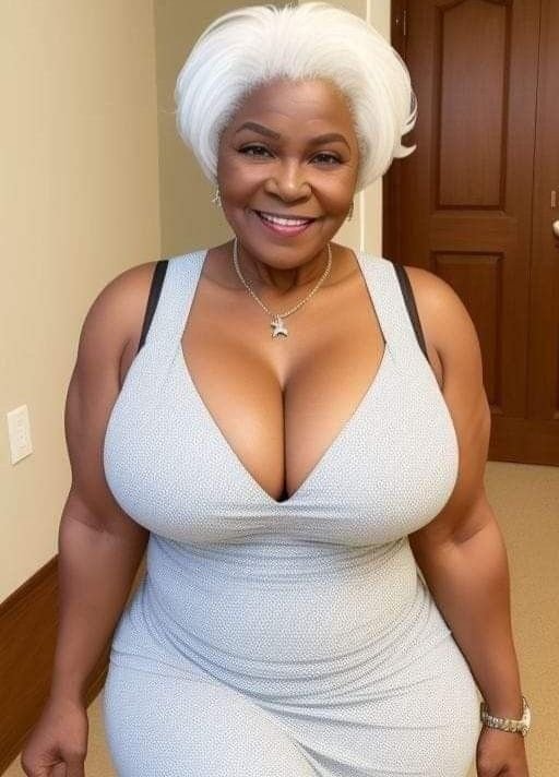 Granny phone sex UK profile featuring smiling mature woman Mature phone sex granny with elegant white hairstyle Phone sex grannies UK profile in grey dress