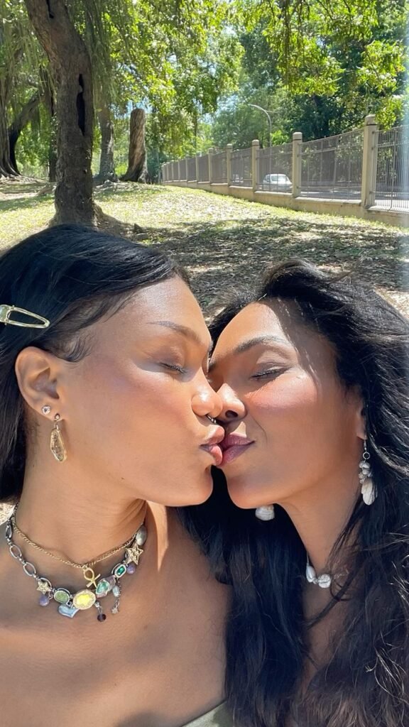 Girls on girls chat UK profile featuring two women outdoors Lesbian phone chat UK female duo in a park Women seeking women chat profile with elegant casual style Girls on girls phone chat UK profile image Lesbian chat lines UK confident female pair Adult chat UK girls on girls category profile