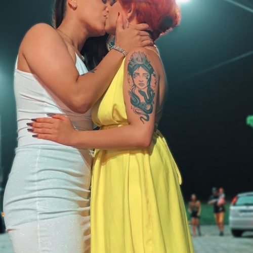 Girls on girls chat UK profile featuring two confident women Lesbian phone chat UK female couple in evening outfits Women seeking women chat profile with modern fashion Girls on girls phone chat UK profile image Lesbian chat lines UK confident female duo