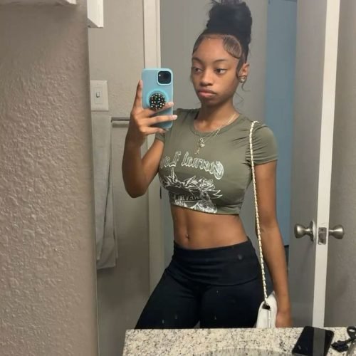 Confident woman taking a mirror selfie representing phone sex chat UK and adult chat