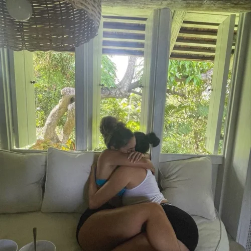 Girls on girls chat UK profile featuring two women embracing Lesbian phone chat UK female couple in a cozy indoor setting Women seeking women chat profile with relaxed atmosphere Girls on girls phone chat UK profile image Lesbian chat lines UK friendly female duo