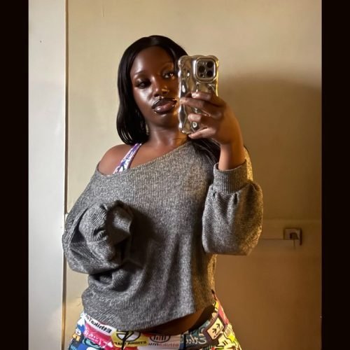 Thick curvy UK phone chat model Kymora Dax with relaxed street style and confident presence