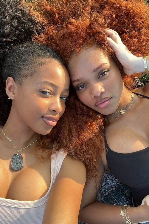 Girls on girls chat UK profile featuring two women relaxing together Lesbian phone chat UK female duo with natural hairstyles Women seeking women chat profile outdoors Girls on girls phone chat UK profile image Lesbian chat lines UK confident female pair Adult chat UK girls on girls category profile