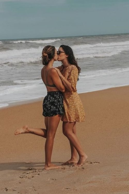 Girls on girls chat UK profile featuring two women on the beach Lesbian phone chat UK female couple by the ocean Women seeking women chat profile in a seaside setting Girls on girls phone chat UK beach profile image Lesbian chat lines UK confident female duo Adult chat UK girls on girls category profile