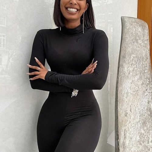 Confident elegant woman in black outfit representing phone sex chat UK and adult chat