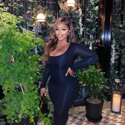 Elegant woman in black dress representing adult chat UK and phone sex chat