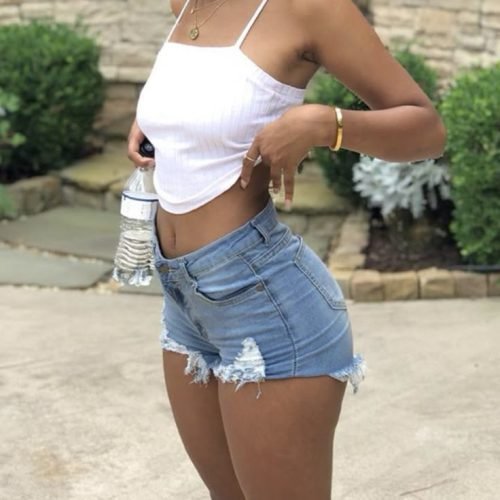 Smiling confident woman outdoors representing adult chat UK and phone sex chat