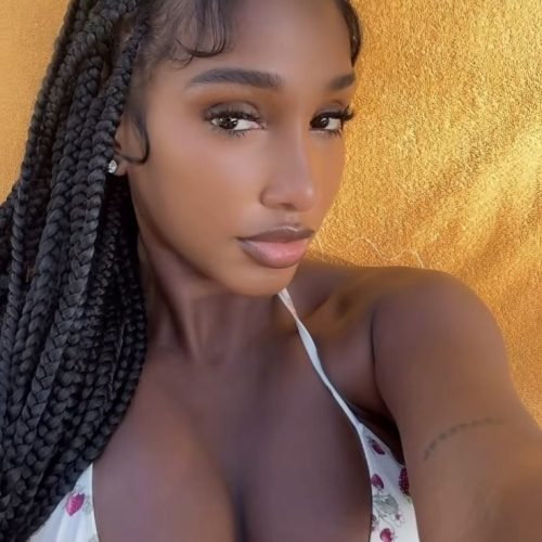 Confident woman with braids representing phone sex chat UK and adult chat with horny girls