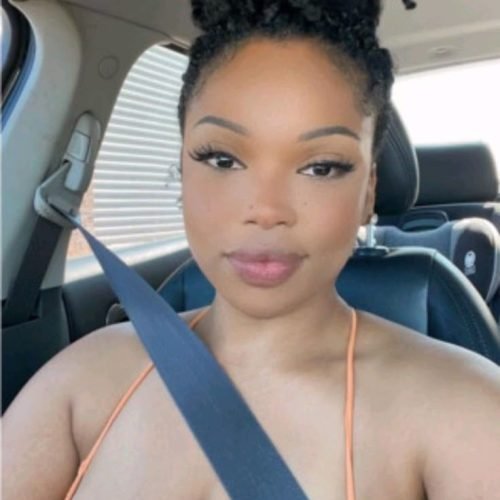 Natural curvy UK phone chat model Tahlia Renne with high bun and calm confident presence