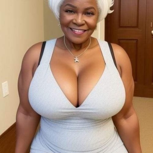 Granny phone sex UK profile featuring smiling mature woman Mature phone sex granny with elegant white hairstyle Phone sex grannies UK profile in grey dress