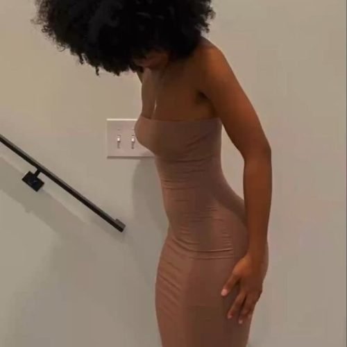 Elegant confident woman in a fitted dress representing phone sex chat UK and adult chat