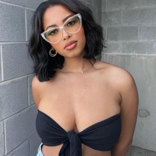 Confident woman wearing glasses representing phone sex chat UK and adult chat with horny girls