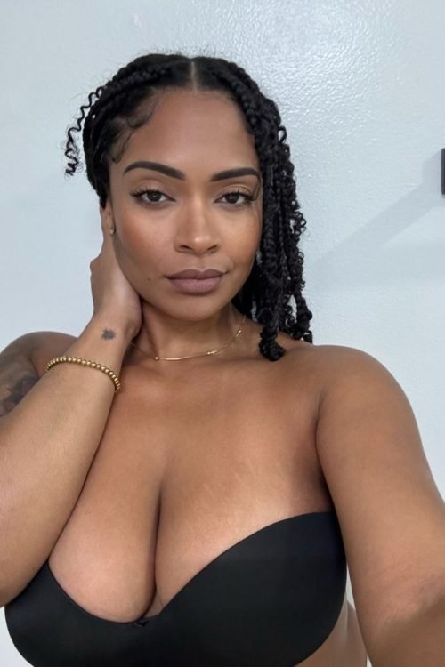 Calm curvy UK phone chat model Aureya Calmyn with natural braids and confident presence