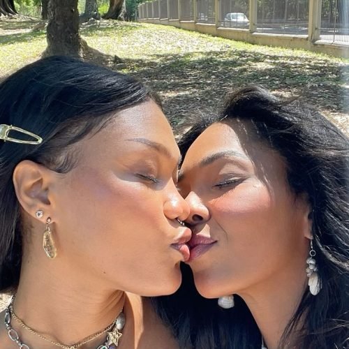 Girls on girls chat UK profile featuring two women outdoors Lesbian phone chat UK female duo in a park Women seeking women chat profile with elegant casual style Girls on girls phone chat UK profile image Lesbian chat lines UK confident female pair Adult chat UK girls on girls category profile