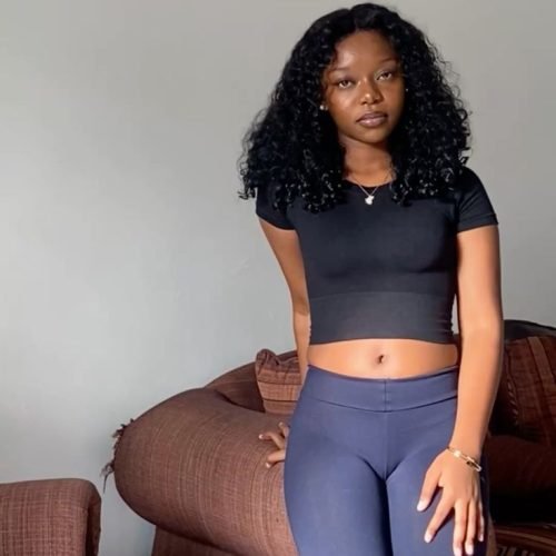 Confident woman in casual fitted wear representing UK phone sex chat and adult chat